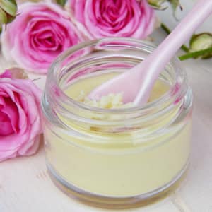 jar of cream with pink roses