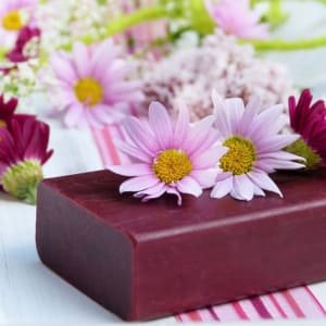 bar of homemade soap with daisies
